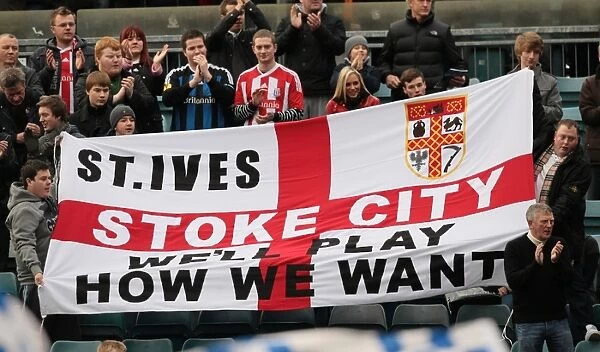 Passionate Fans of Stoke City in Action at Gillingham Match on January 7, 2012