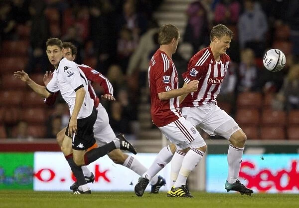 Stoke City's Double Threat: Higginbotham and Jones Secure 2-0 Carling Cup Triumph Over Fulham (September 21, 2010)