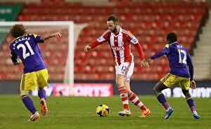 Stoke City v Swansea City Collection: Battle at Bet365 Stadium: Stoke City vs Swansea City Clash - February 12, 2014