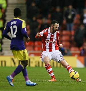 Images Dated 18th February 2014: Battle at Bet365: Stoke City vs Swansea City - February 12, 2014