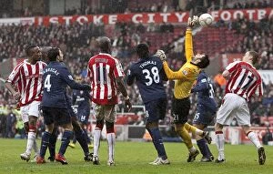 Images Dated 24th January 2010: Clash at the Britannia: Stoke City vs Arsenal (January 24, 2010)