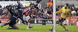Images Dated 24th January 2010: Clash at the Britannia: Stoke City vs Arsenal (January 24, 2010)