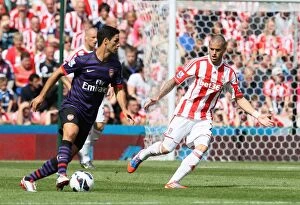 Images Dated 26th August 2012: Clash at the Britannia: Stoke City vs Arsenal - August 26, 2012
