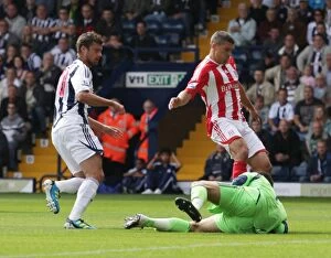 Images Dated 28th August 2011: Clash at The Hawthorns: West Bromwich Albion vs Stoke City, August 28th