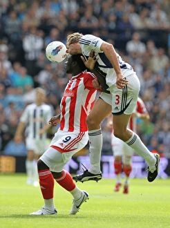 Images Dated 28th August 2011: Clash at The Hawthorns: West Bromwich Albion vs Stoke City, August 28th