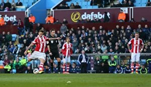 Images Dated 28th March 2014: Clash of the Villans and Potters: Aston Villa vs Stoke City - March 23, 2014