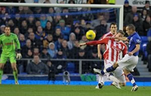 Images Dated 4th December 2011: The Decisive Moment: Everton vs. Stoke City Rivalry Unfolds (December 4, 2011)