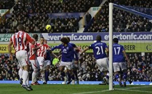 Images Dated 4th December 2011: Decisive Moments: Everton vs. Stoke City - The Battle for Victory (4th December 2011)