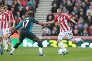 Images Dated 28th April 2012: The Intense Battle: Stoke City vs Arsenal, April 28, 2012