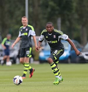 Images Dated 20th July 2013: Stoke City vs Burton Albion: Clash of the Potters