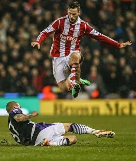 Stoke City v Liverpool Collection: Stoke City vs Liverpool Clash: A Battle at Bet365 Stadium - January 12, 2014
