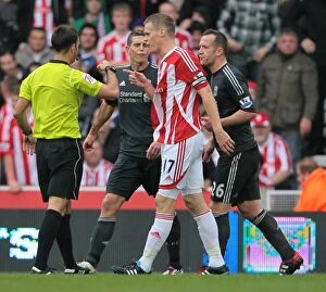 Images Dated 10th September 2011: Stoke City vs Liverpool: Clash of Titans (September 10, 2011)