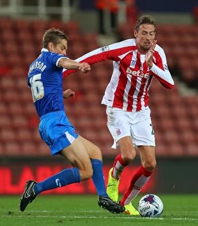 Images Dated 4th September 2014: Stoke City vs Portsmouth Clash: Battle at Bet365 Stadium - August 27, 2014