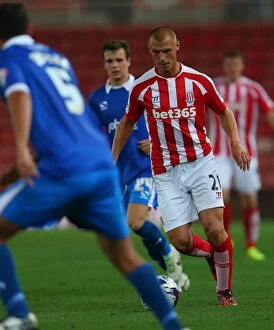 Images Dated 4th September 2014: Stoke City vs Portsmouth Clash at Bet365 Stadium: August 27, 2014