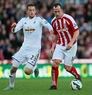 Images Dated 28th October 2014: Stoke City vs Swansea City Clash at Bet365 Stadium - October 19, 2014