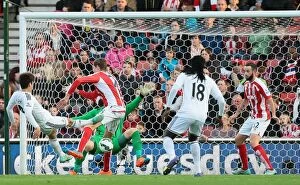 Stoke City v Swansea City Collection: Stoke City vs Swansea City: Clash of the Championship Contenders (19th October 2014)