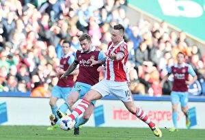 Images Dated 19th March 2014: Stoke City vs West Ham United: Clash at the Bet365 Stadium - March 15, 2014